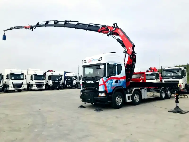 WB Services long reach Hiab with its crane boom at full extension in the depot yard