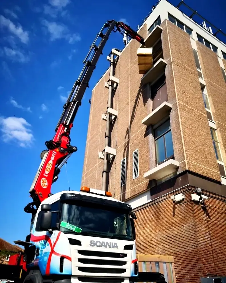 WB Services long reach Hiab lifting materials up to a high-level balcony